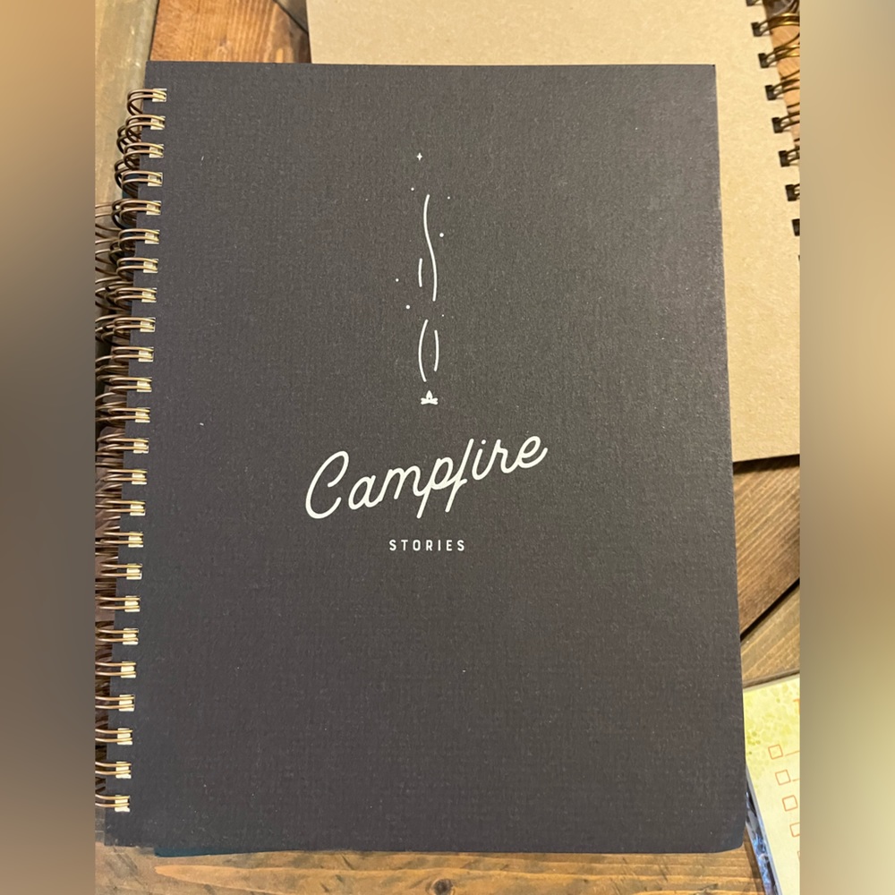 NWT small spiral notebook. Lined paper. “ Campfire Stories” 8.5”x6.5”